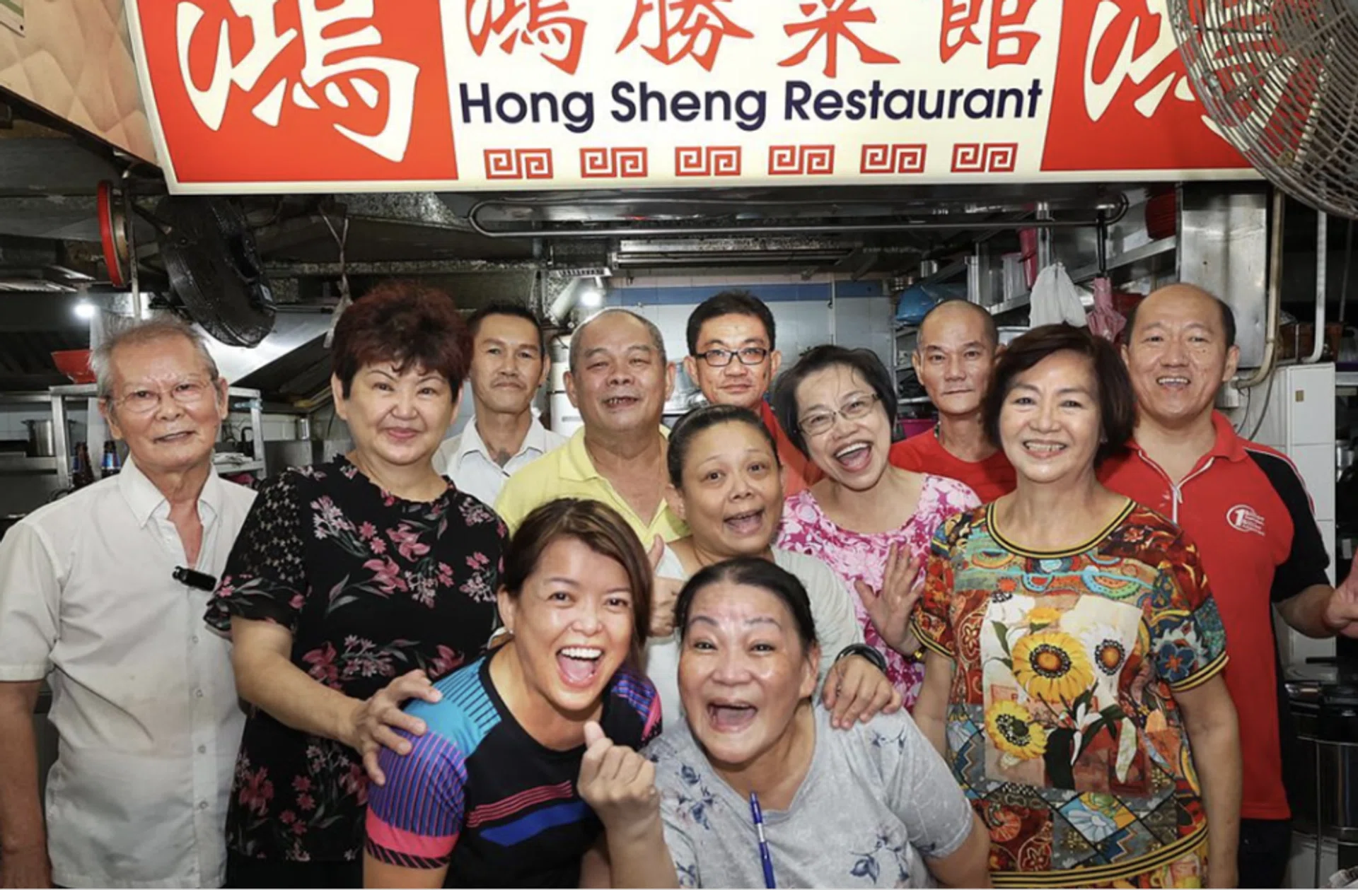Owner Lin Youhao (second from left) with her workers.
