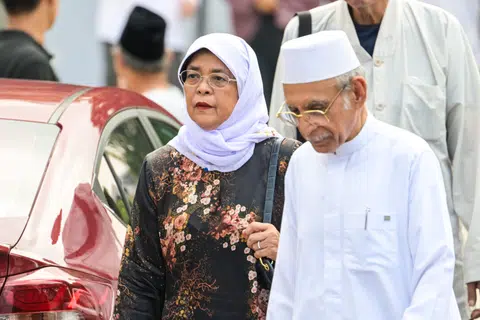 Madam Halimah Yacob (left) arrives at the funeral of Puan Noor Aishah Mohammad Salim, the wife of Singapore's first President Yusof Ishak, at Bad'alwie Mosque on April 22.