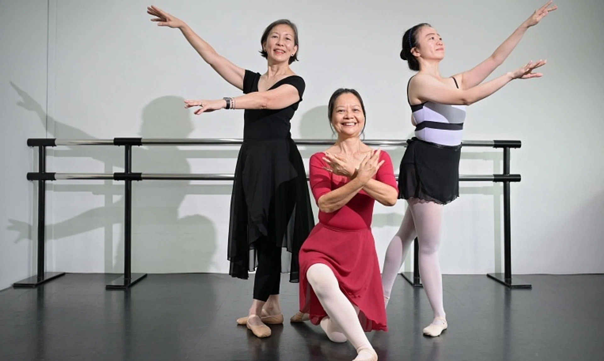 (From left) Retiree Su Yim Lai, 63, and semi-retiree Kat Lam, 62, who are Silver Swans classmates, with dance teacher Siew Lin Fong, 39, at The Ballet Academy.
