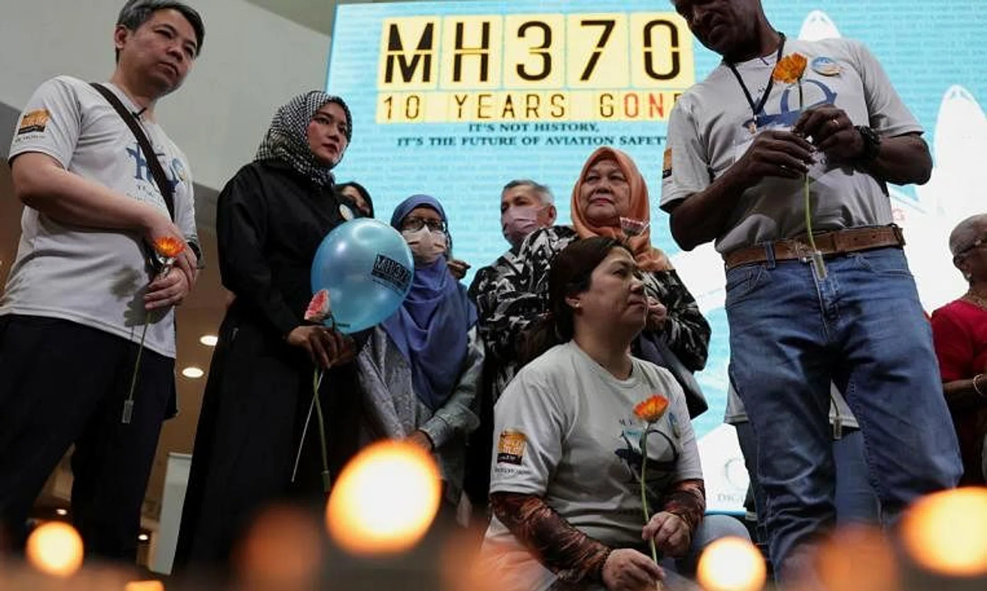 Families of passengers attending a remembrance event commemorating the 10th anniversary of the MH370 airplane's disappearance, on March 3. 