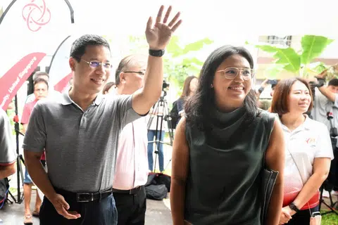 National Development Minister Desmond Lee (left) with trade unionist Natasha Choy at the launch of Our Residents' Hub at the Jalan Mas Kuning Playground on April 2.