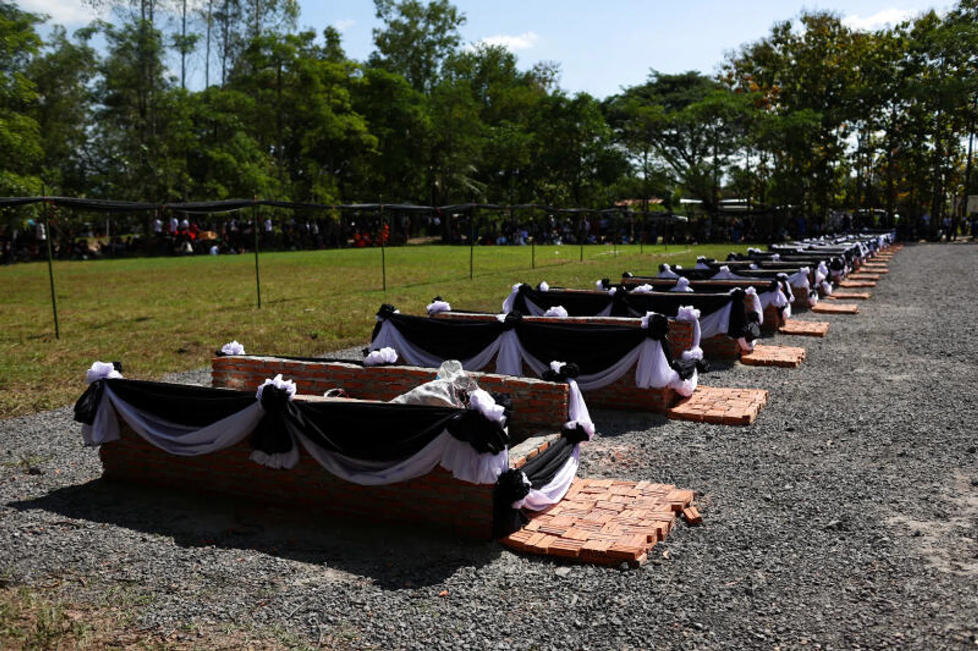 A view of funeral pyres decorated with black and white ribbons before the cremation ceremony of the victims of a mass shooting at a day care centre, at Wat Rat Samakee temple in Uthai Sawan, Thailand. 