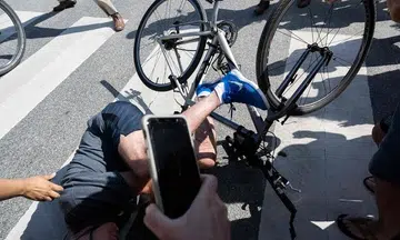 Biden falls off bike while coming to a stop, says he's okay