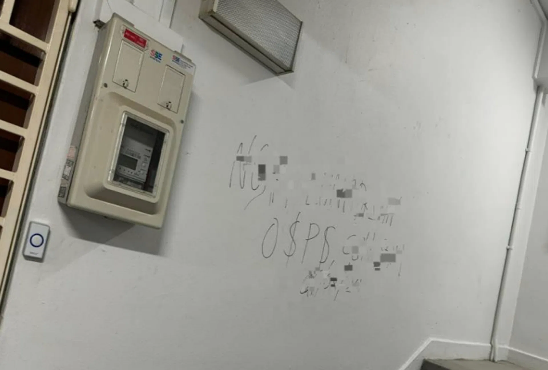 The man scribbled on the wall next to the unit.
