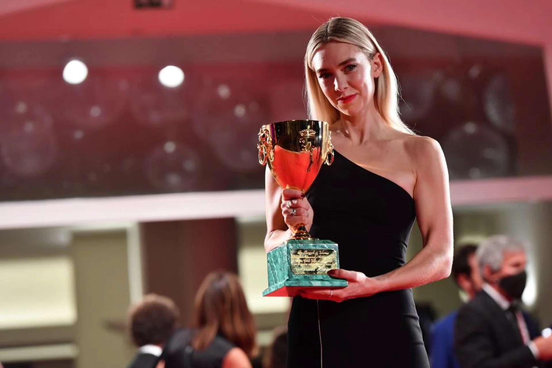 British actress Vanessa Kirby holds the Volpi Cup (Coppa Volpi) Award for Best Actress for her performance in the movie 'Pieces of a Woman' during the awarding ceremony of the 77th annual Venice International Film Festival, in Venice, Italy, 12 September 2020. 