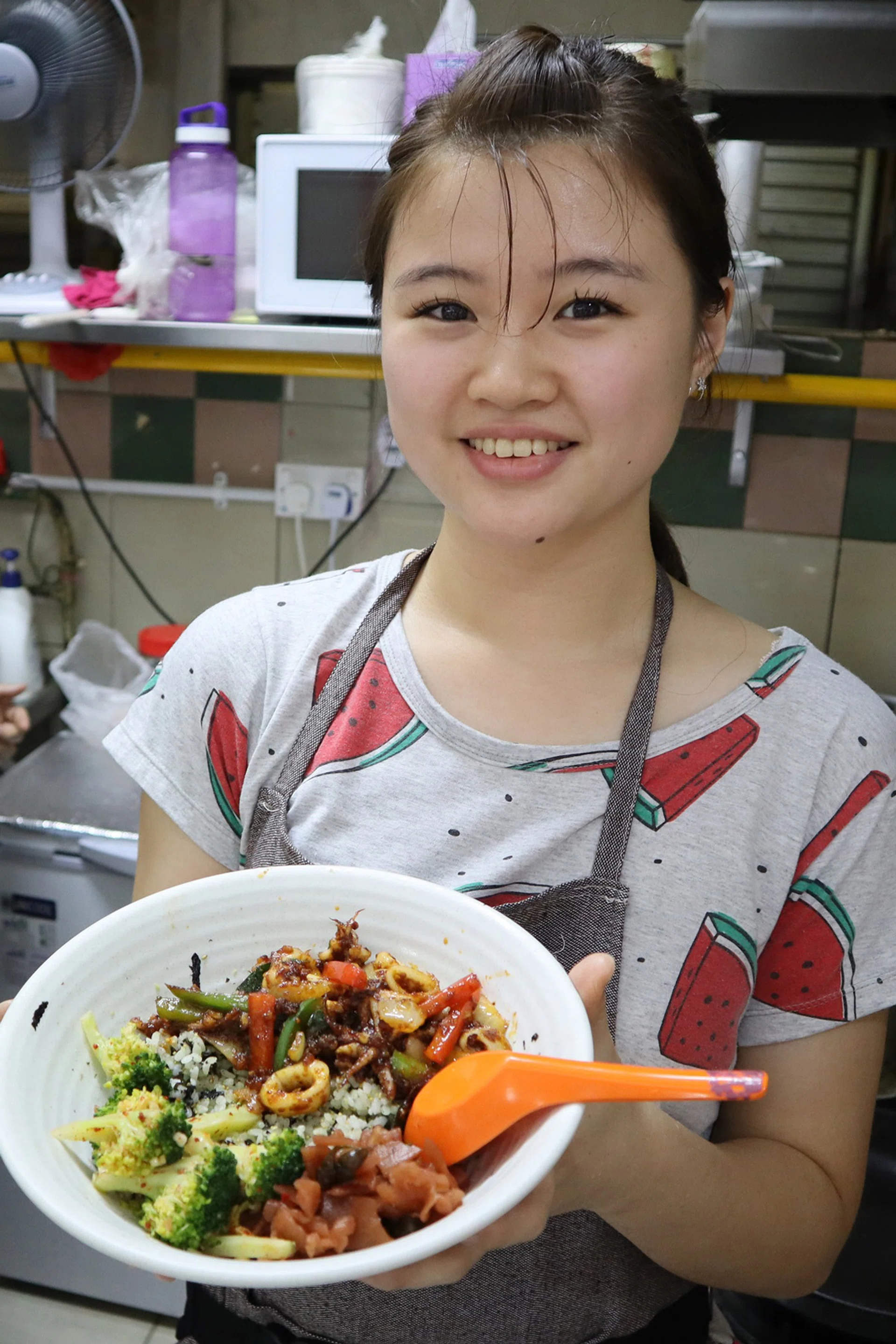 Miss Jocelyn Yu, 24, with her eclectic Korean menu at Illuwa.