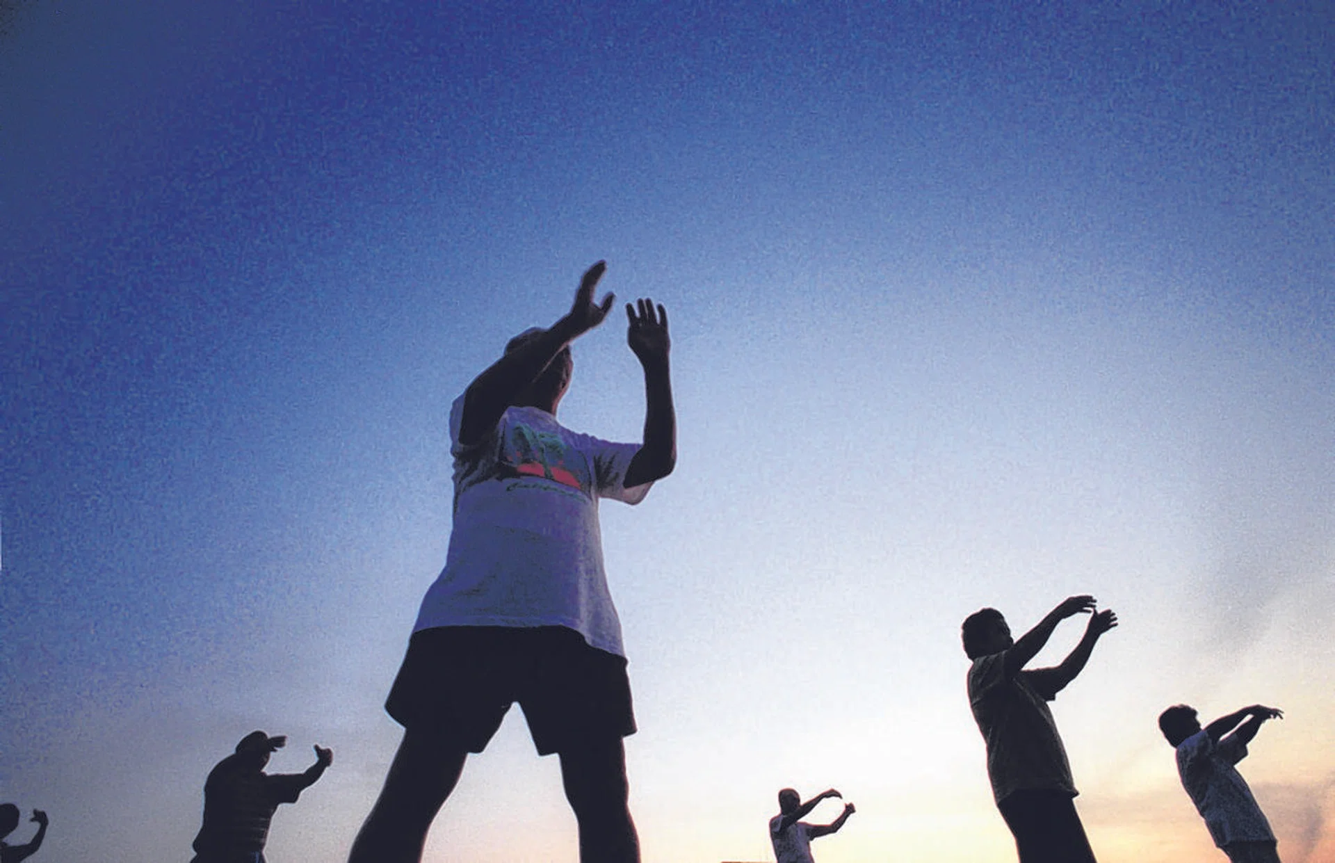 Elderly folk practising taichi in Bishan Park.
