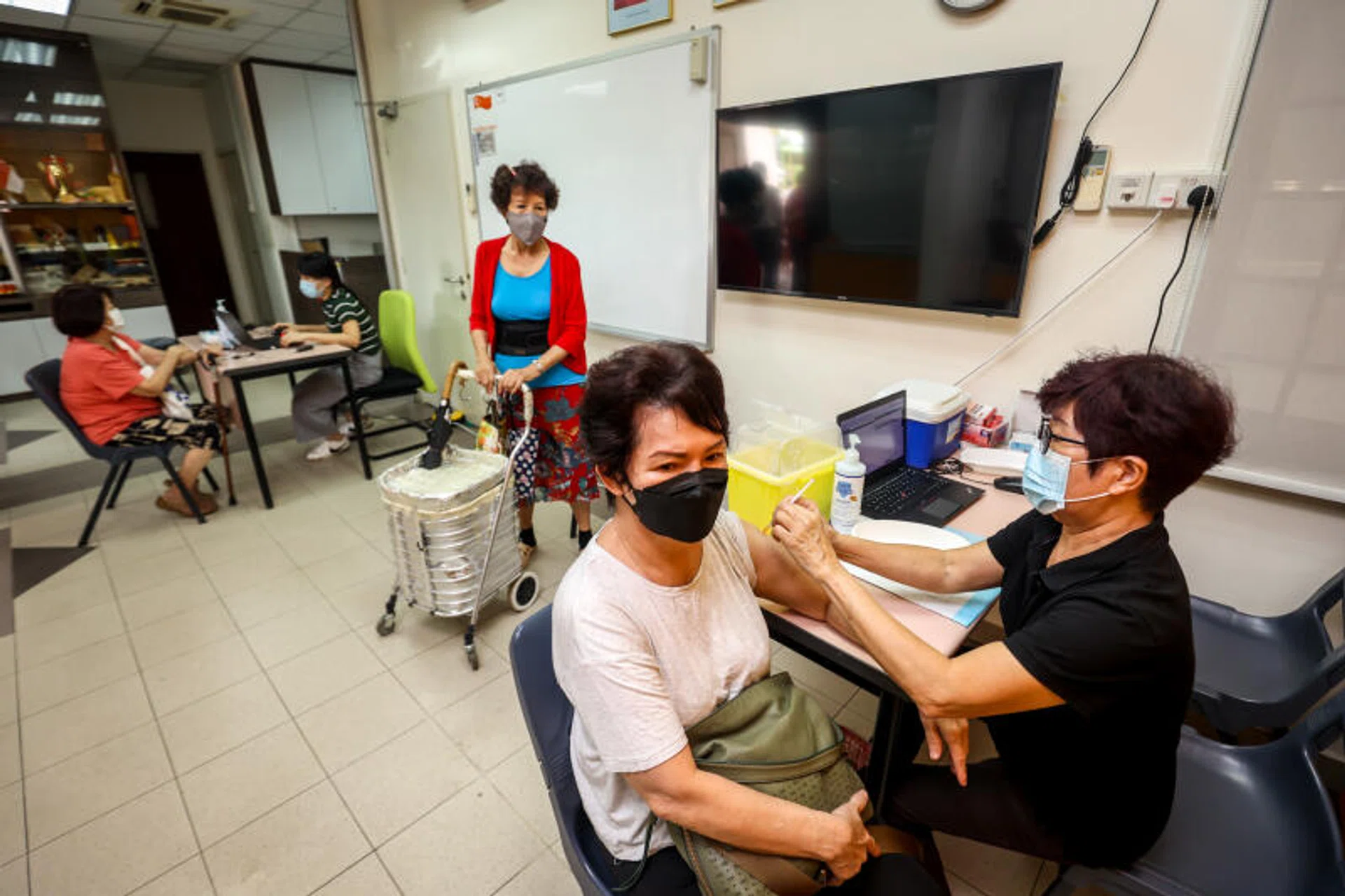 Singaporeans should still take their Covid-19 booster jabs even if they have been previously infected with the virus