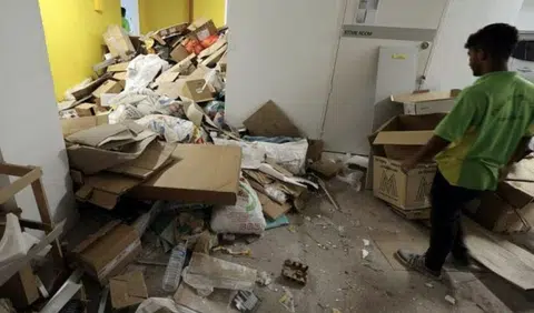 Punggol void deck filled with trash dumped by contractors