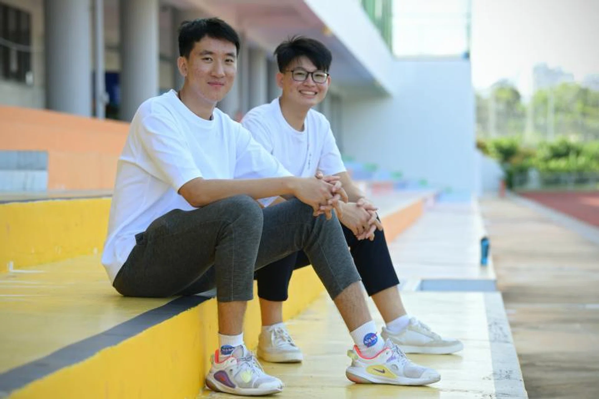 Jurong Pioneer JC student Xu Zhetai (left) suffered a cardiac arrest during basketball training in 2021. His best friend Joshua Lim was one of the first responders. 
