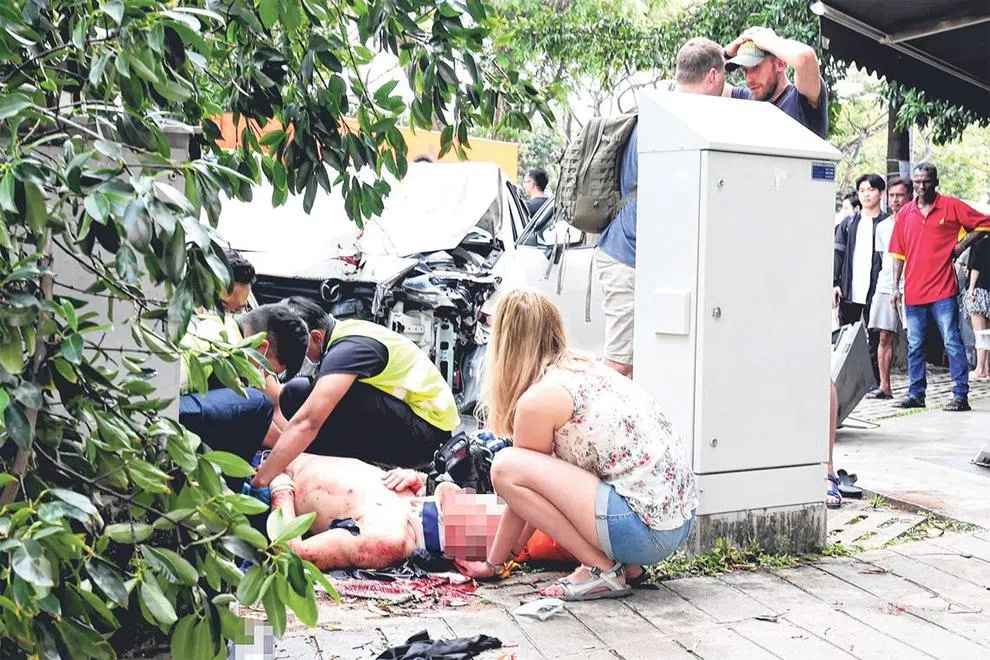 Car crashes into man standing at roadside in Geylang; driver appears dazed and disoriented
