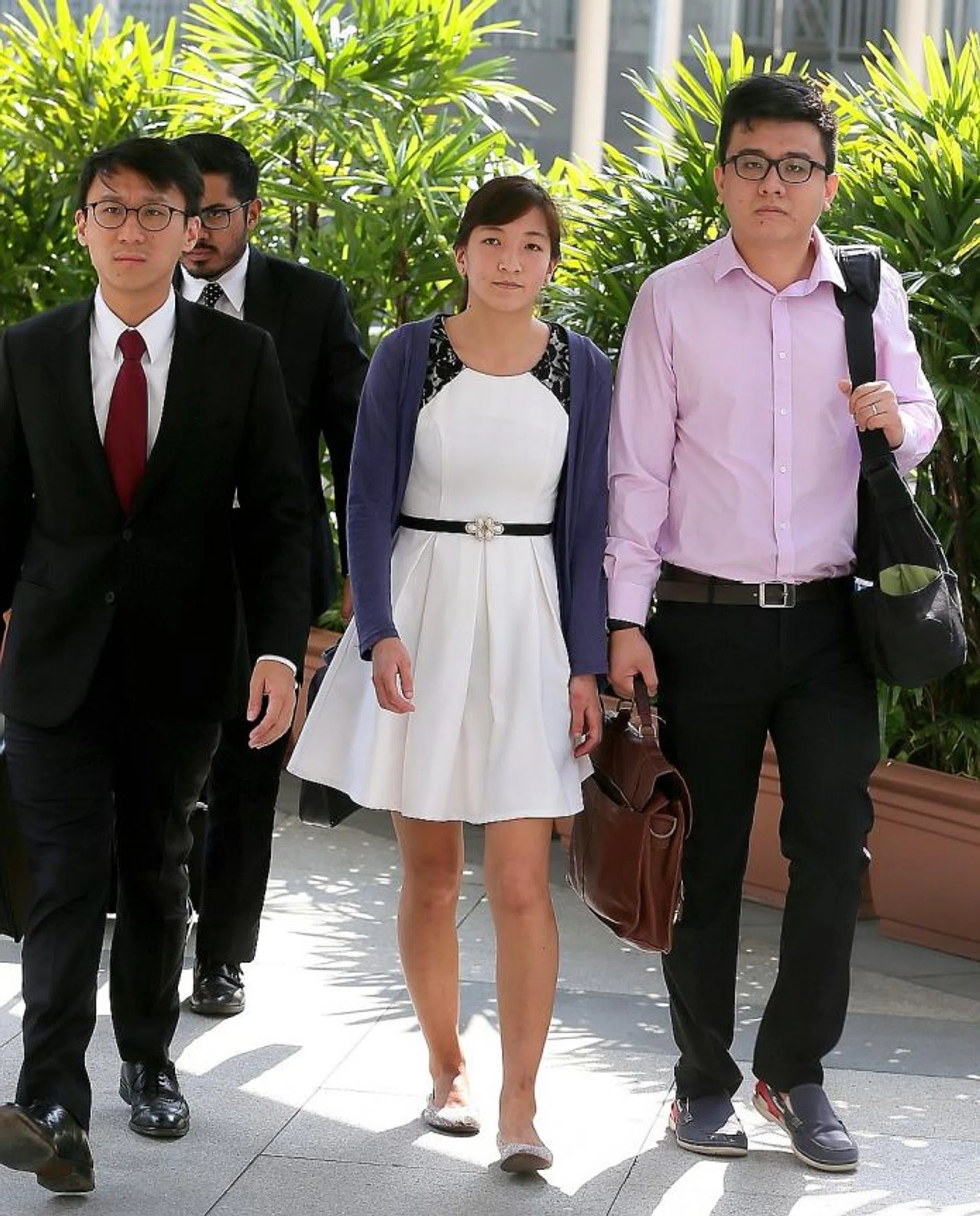 IN COURT: (From left) Defence counsel Choo Zheng Xi, Ai Takagi and Yang Kaiheng.