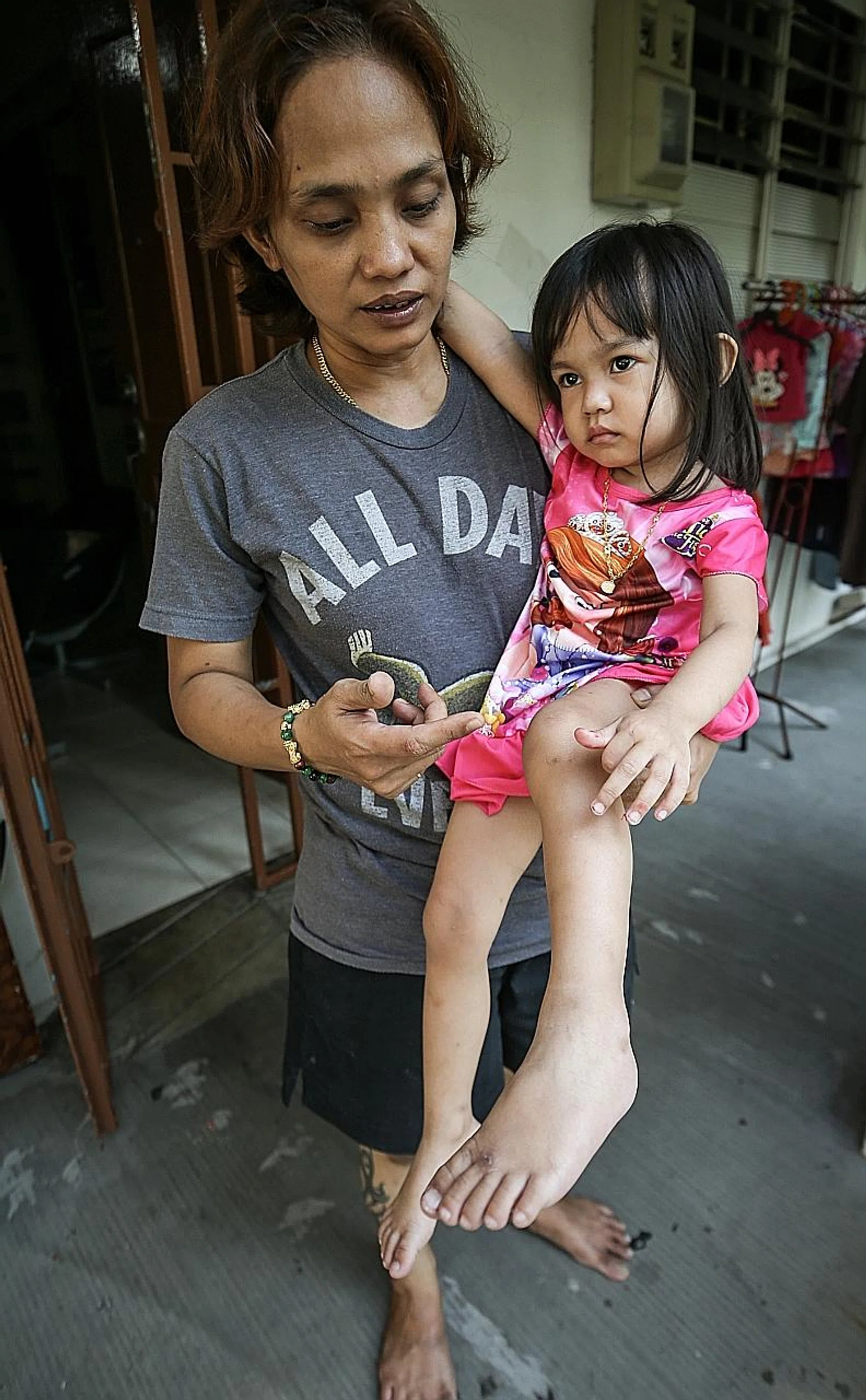 Madam Siti Aisah with her daughter Nur Syahirah.
