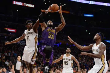 Sick, but LeBron scores third triple-double with Lakers