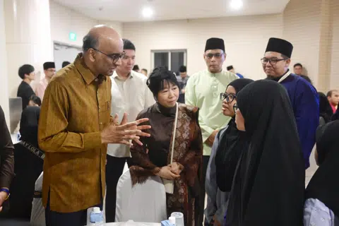 President Tharman Shanmugaratnam and his spouse mingling with Muis Zakat beneficiaries at a buka puasa event at Masjid Maarof.