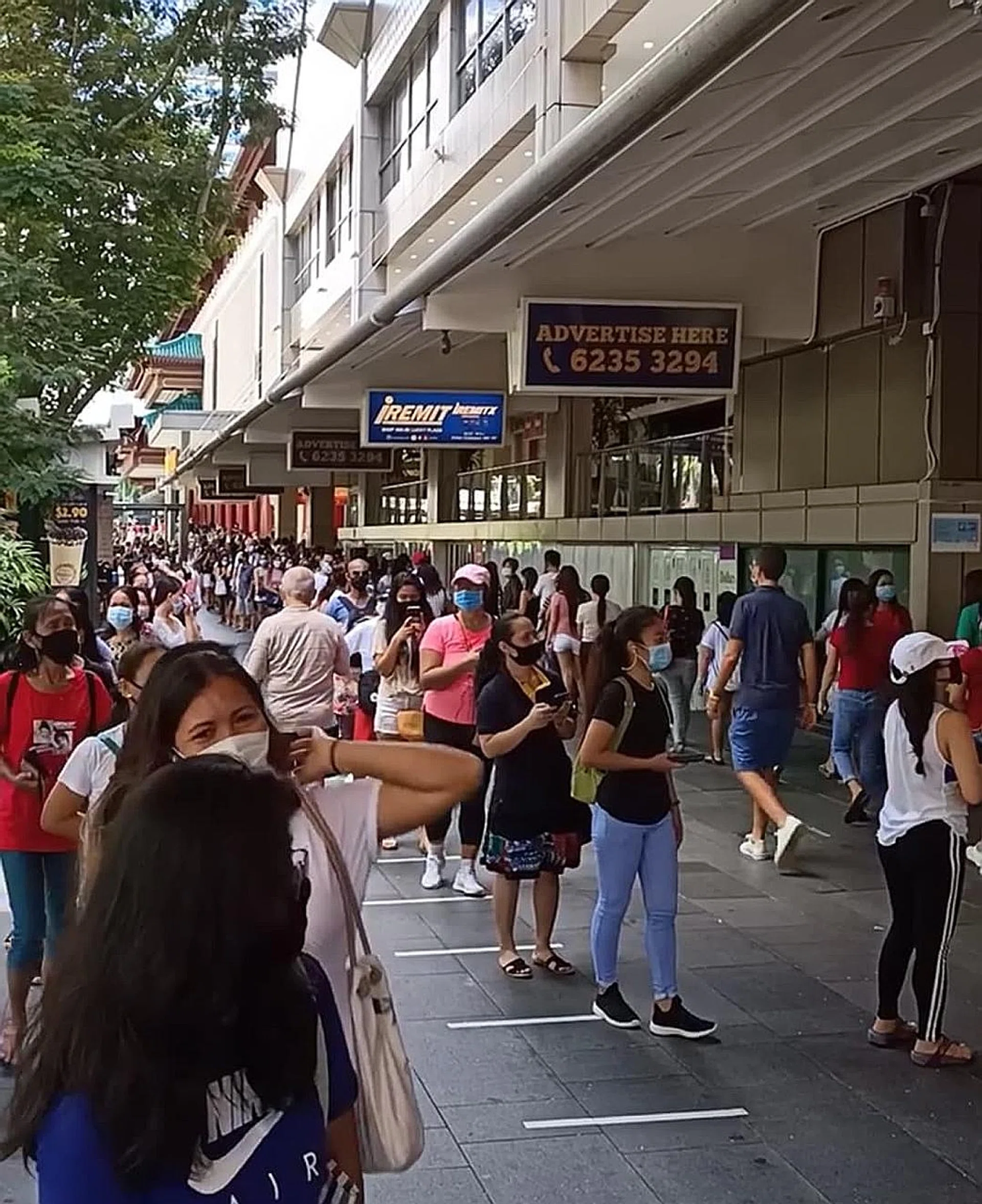 Photos of snaking queues outside Lucky Plaza on social media led some netizens to raise concerns about safe distancing rules being breached. 