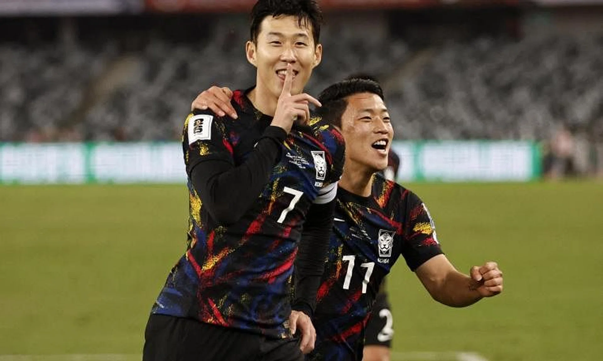 South Korea captain Son Heung-min celebrates with Hwang Hee-chan after scoring the first goal against China.