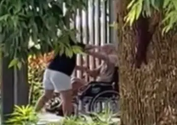 Police investigating after online video shows woman 'causing hurt' to elderly man in wheelchair