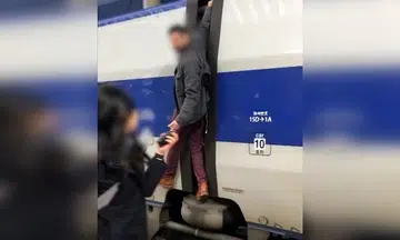 'Let me on the train': Man seen hanging on to moving train in South Korea