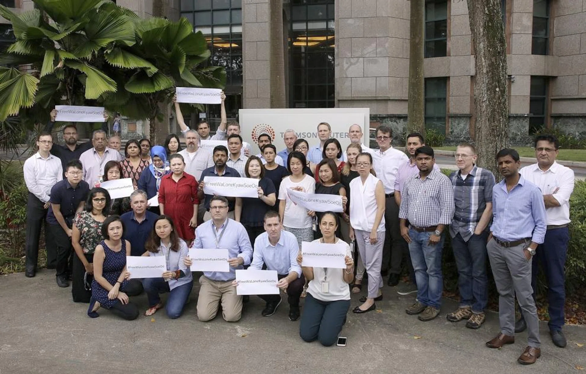 Reuters journalists posted on Twitter a picture of them holding placards outside their headquarters to protest against the jailing of two Myanmar reporters. 