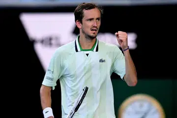 Tempers rise Down Under as Medvedev reaches quarters