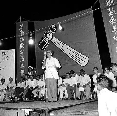 David Marshall of the Workers' Party (WP) speaking at an Anson by-election rally in 1961. Workers' Party election memorabilia, such as the banner in the background, are hard to find, say the owners of Treasure At Home Vintage Store.