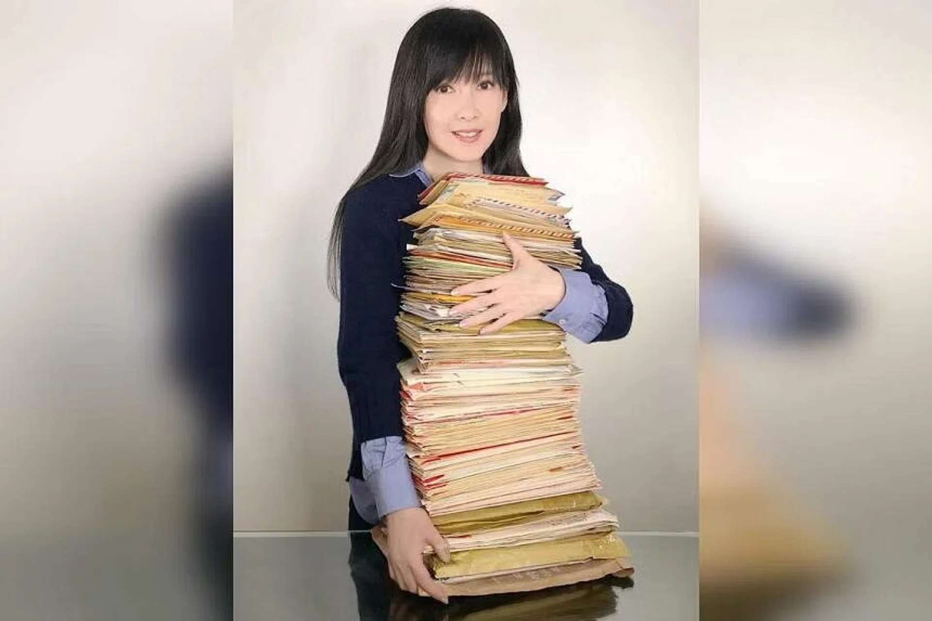 Vivian Chow posted a photo of herself carrying a huge pile of letters on social media in May.