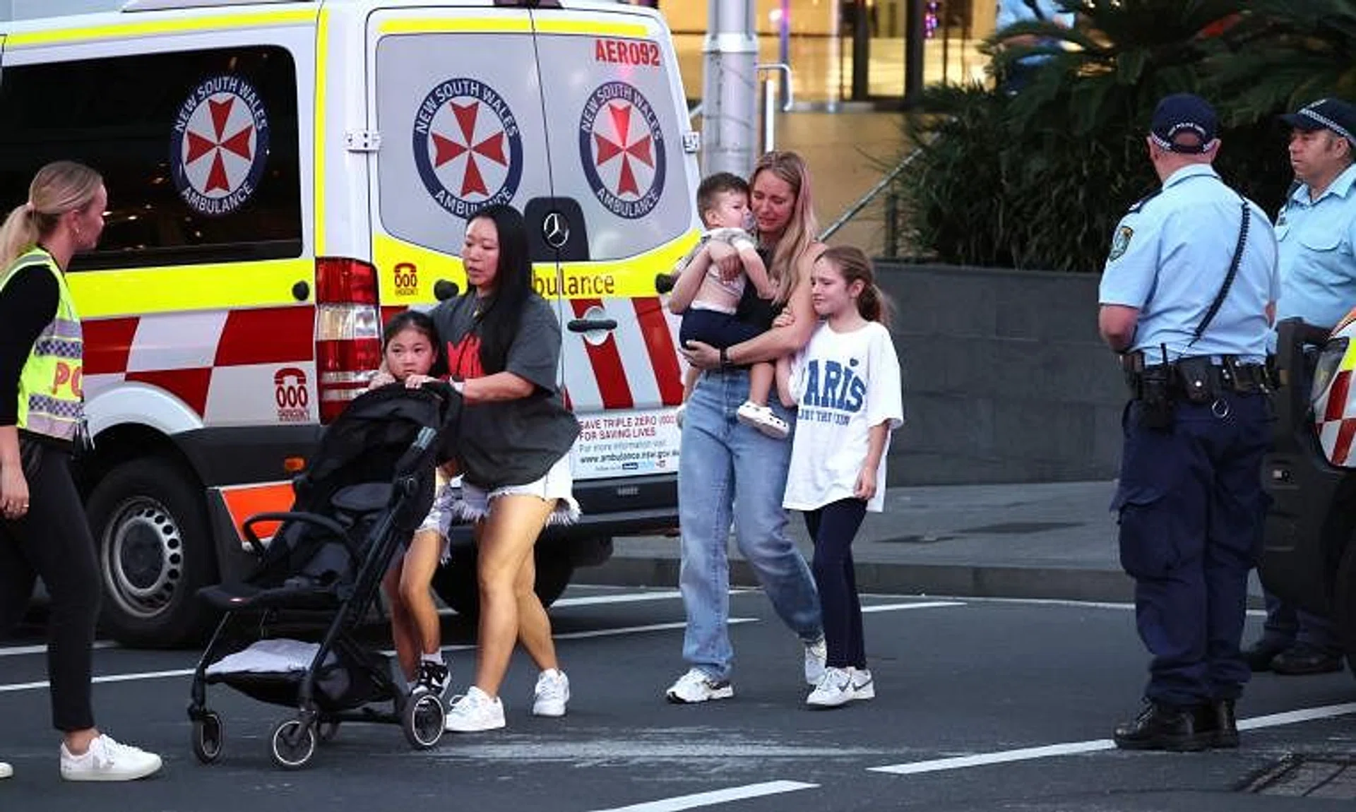 People leaving Westfield Bondi Junction shopping centre after a stabbing incident in Sydney on April 13.