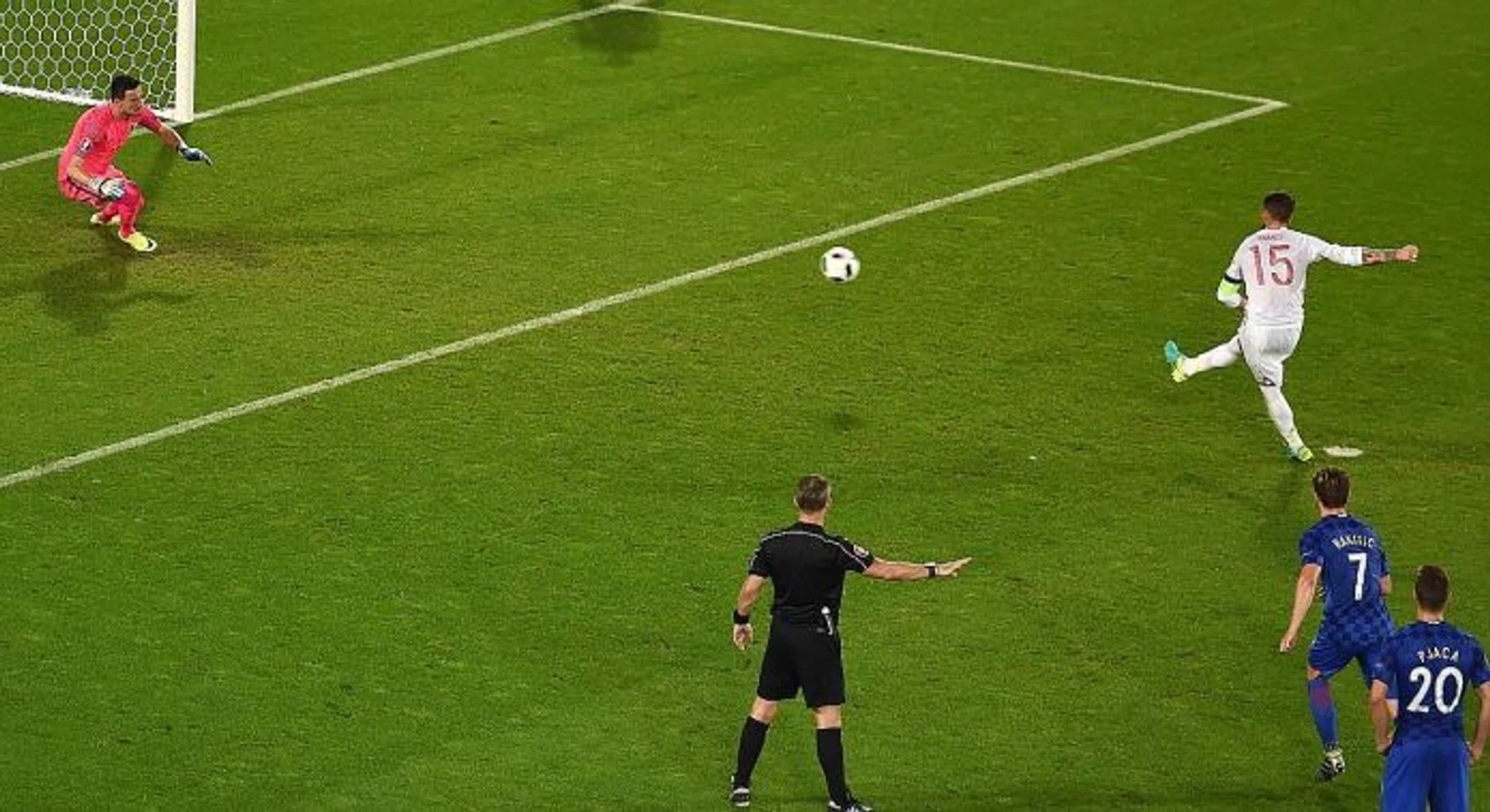 WORDS OF WISDOM: Injured Luka Modric's advice for Croatia teammate Danijel Subasic (above, in pink) helps him save a penalty from Spain's Sergio Ramos (in white).