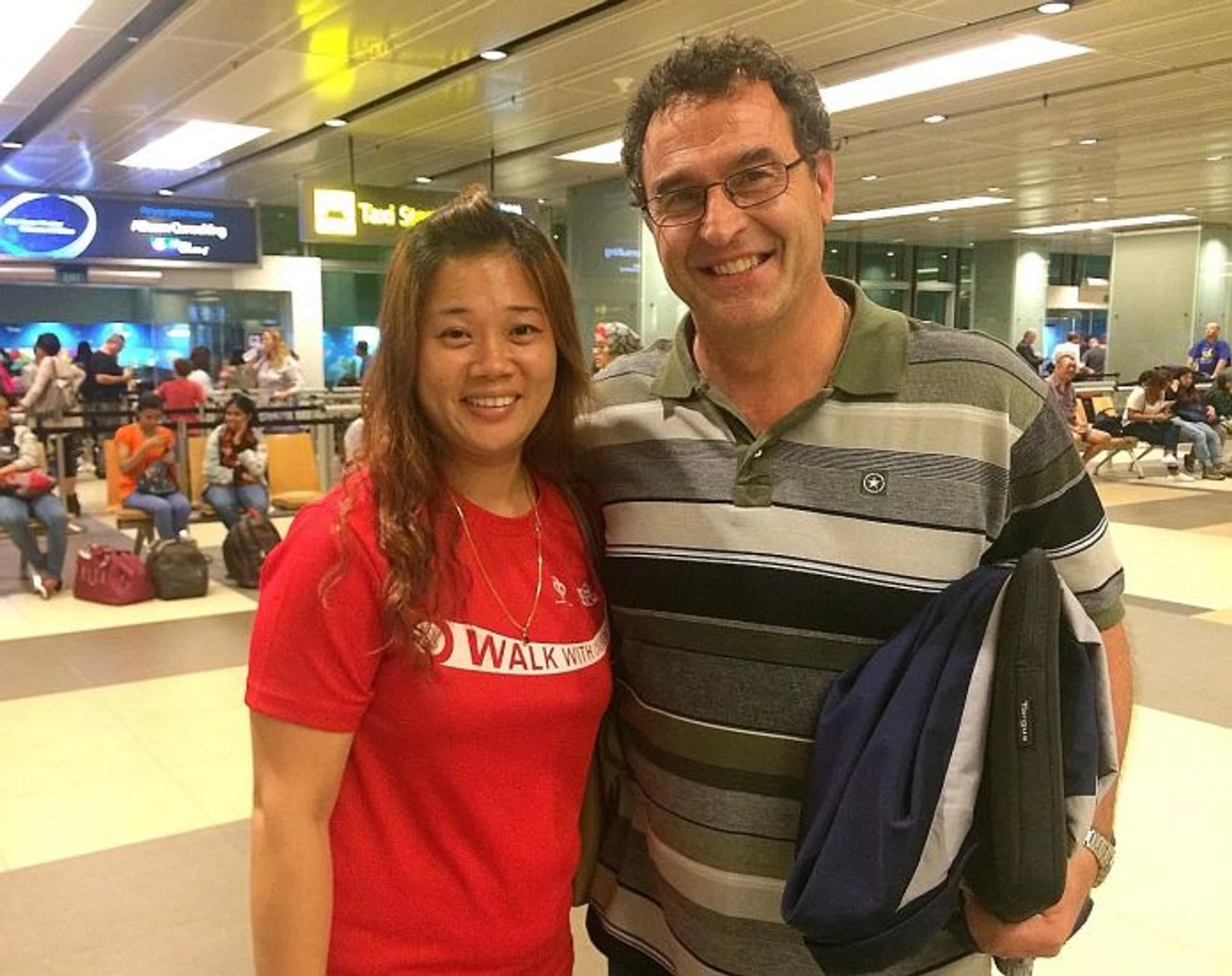 WELCOME: New national men's basketball coach Frank Arsego (right) is received by Basketball Association of Singapore's HR & finance manager Felicia Tey after arriving in Singapore yesterday.   