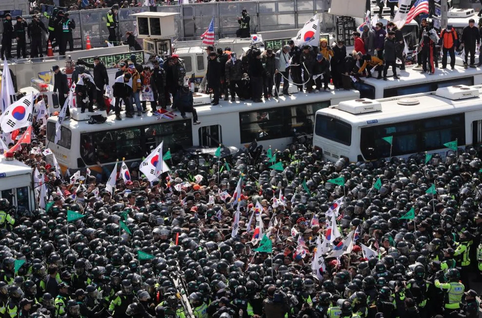 Protesters supporting former president Park Geun Hye clash with riot policemen near the Constitutional Court in Seoul.
