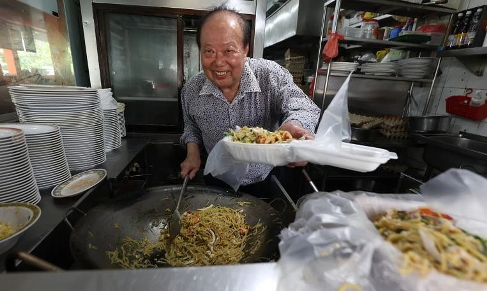 Mr Tan Kue Kim was known to fry Hokkien mee while donning a Rolex watch and long-sleeved shirt.