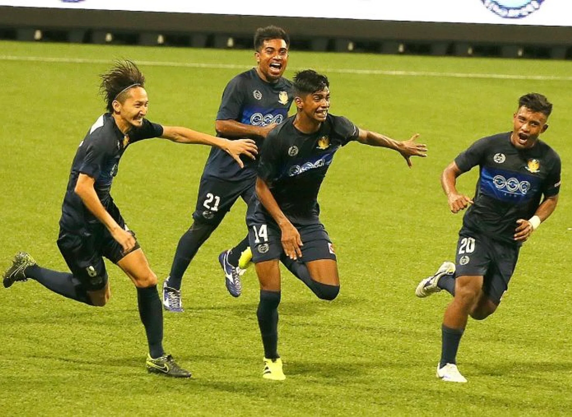MATCH-WINNER:  Iqbal Hussain's (No. 14) late strike sends Hougang through to the Plate final.