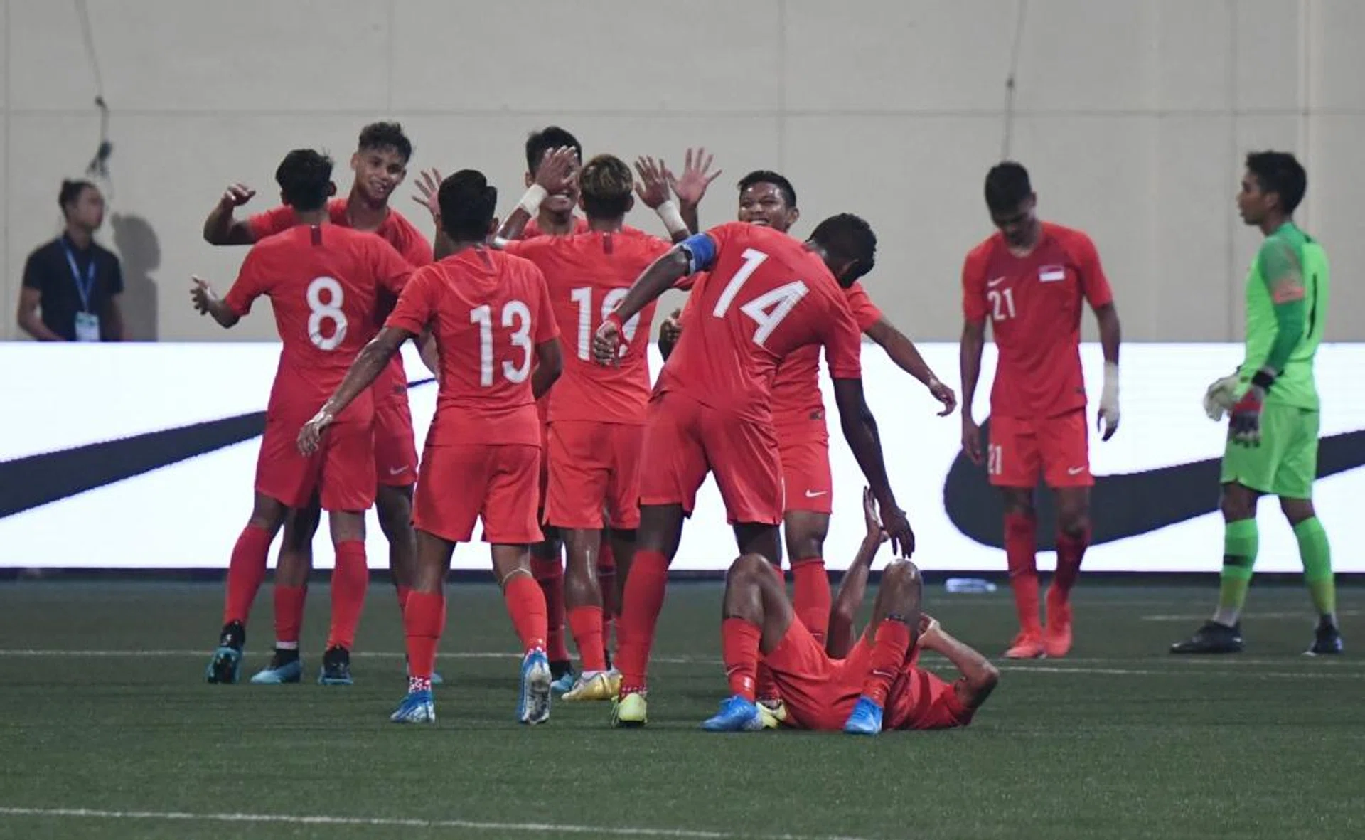 The Lions celebrating their win over Palestine at the Jalan Besar Stadium.