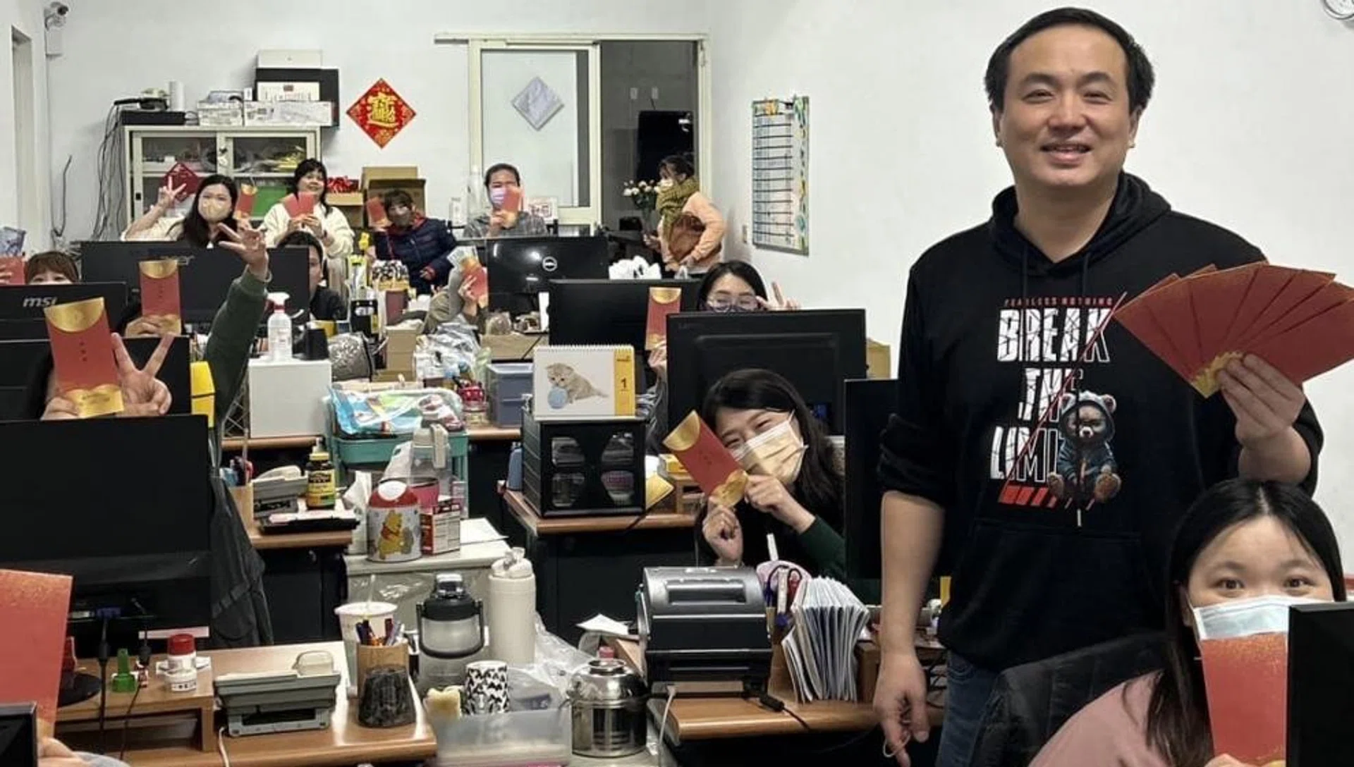 Mr Lu Shaonan with his employees.