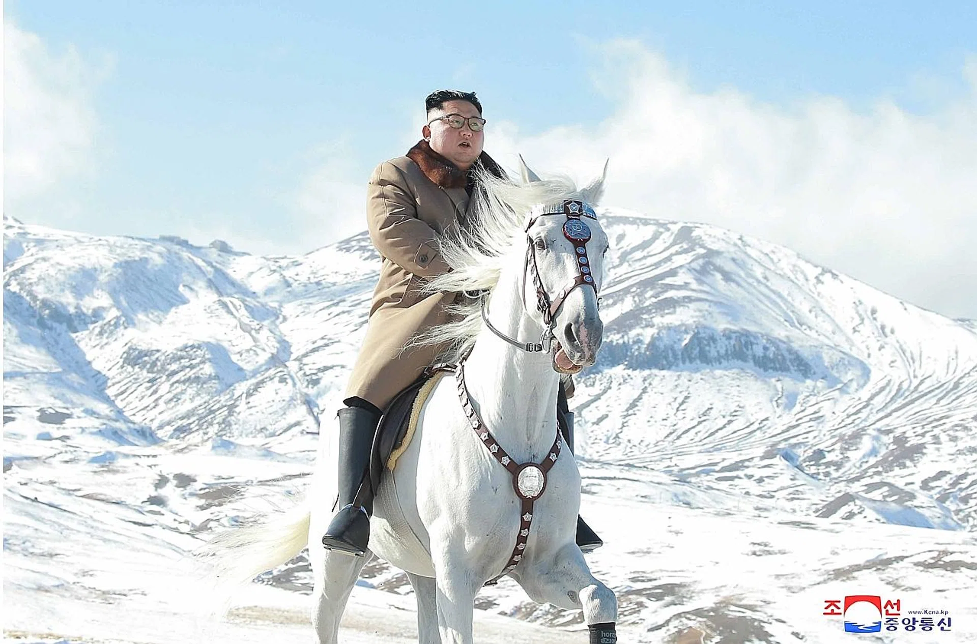 A picture of North Korean leader Kim Jong Un riding a white horse through a winter landscape to the summit of Mount Paektu. 