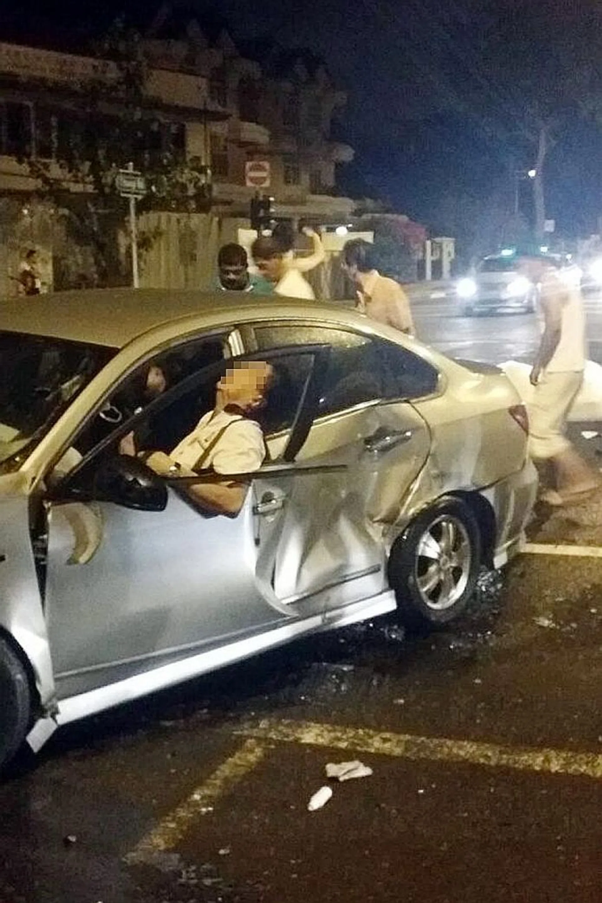 The collision left Madam Poh, 49, trapped under her car and her husband, Mr Kor Leong Chai, 53 (above), who was in the front passenger seat, ended up hanging out of a broken window.
