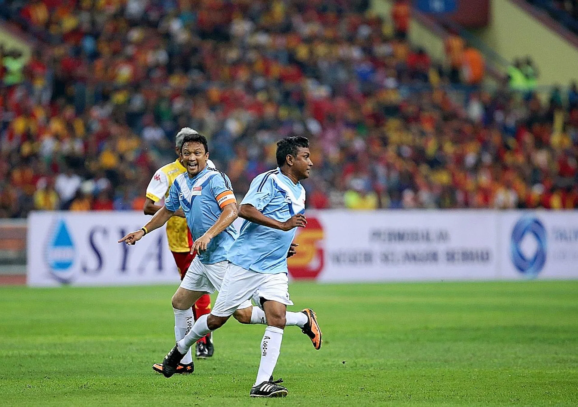 Lions legends Fandi Ahmad (above, left) and V Sundramoorthy (right) in action in the Sultan of Selangor's Cup at Shah Alam Stadium in 2014.