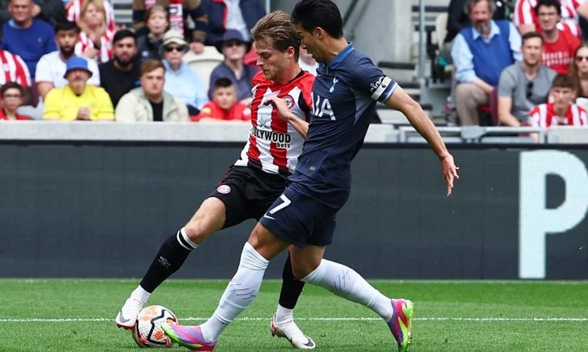 Tottenham Hotspur's newly appointed captain Son Heung-min fouls Brentford midfielder Mathias Jensen to concede a penalty.