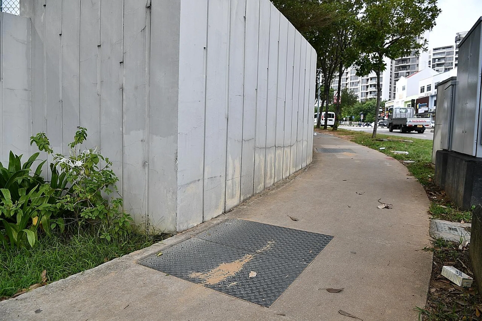 Madam Chan Hui Peng fell into the manhold (above) near Kovan Residences. 