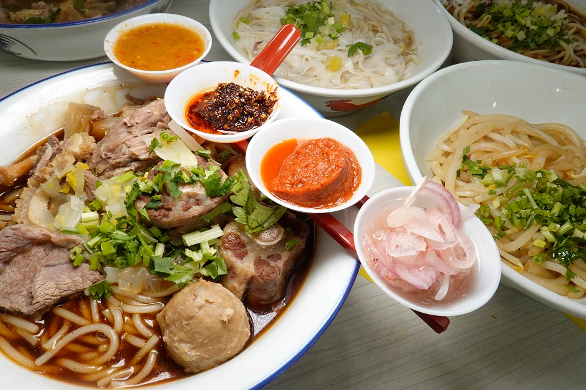 (Above) The original beef noodles with four sauces, the premium version features oxtail and the team behind Horiginal Beef Noodle. 
