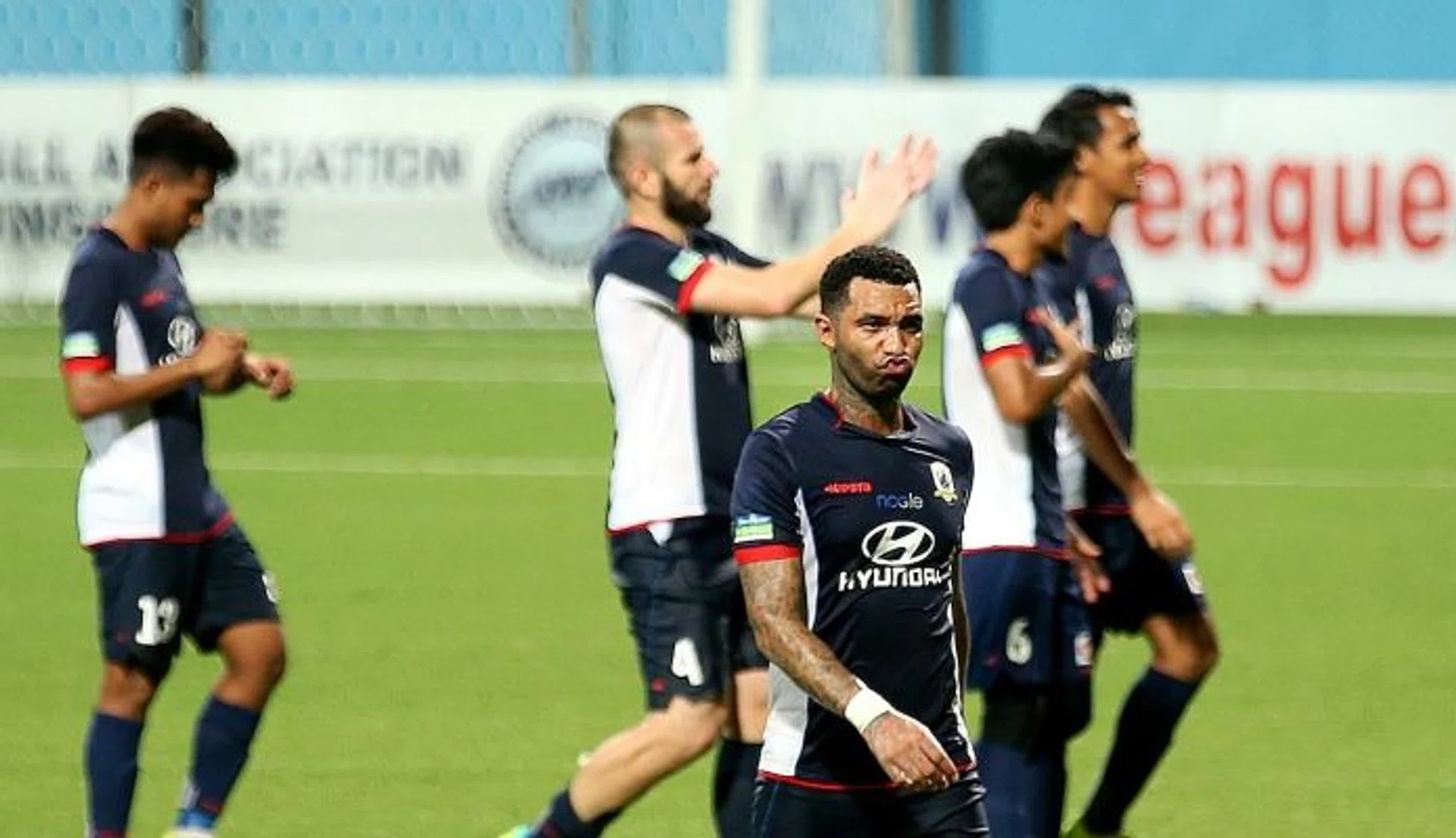 MAIN MAN: Tampines' Jermaine Pennant appears in deep thought as the players walk off the pitch after  the game.