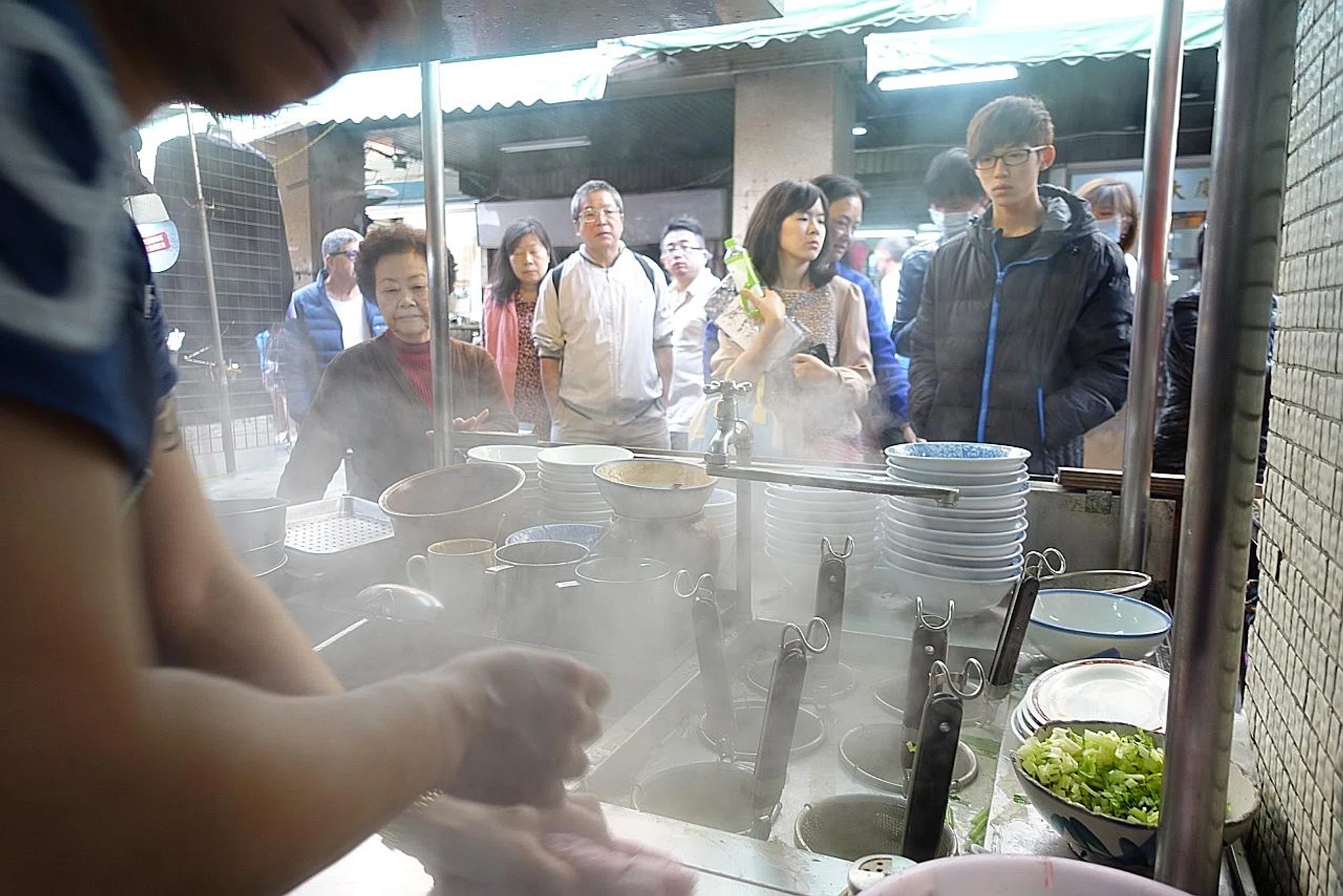 The crowd (above) and the fried pork (below) at A-Jiao Roasted Pork. PHOTOS: MAKANSUTRA