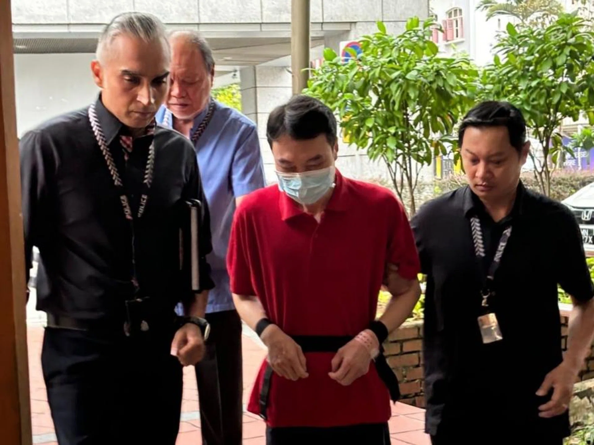 Wu Tao being escorted to the crime scene on Oct 15.