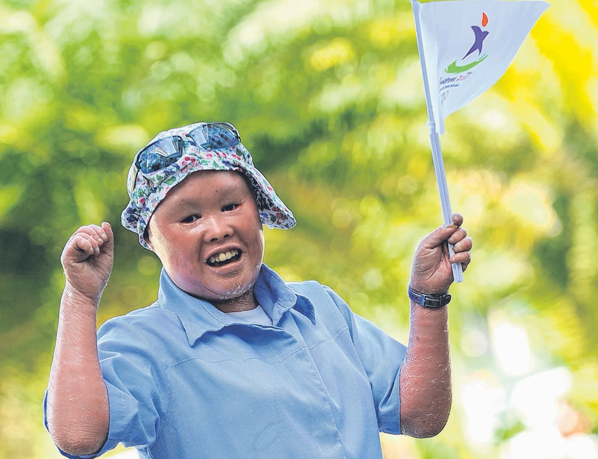 CHEERFUL: Miss Ng was among 2,400 Singaporeans who were selected to carry the Youth Olympic Games (YOG) torch in 2010.