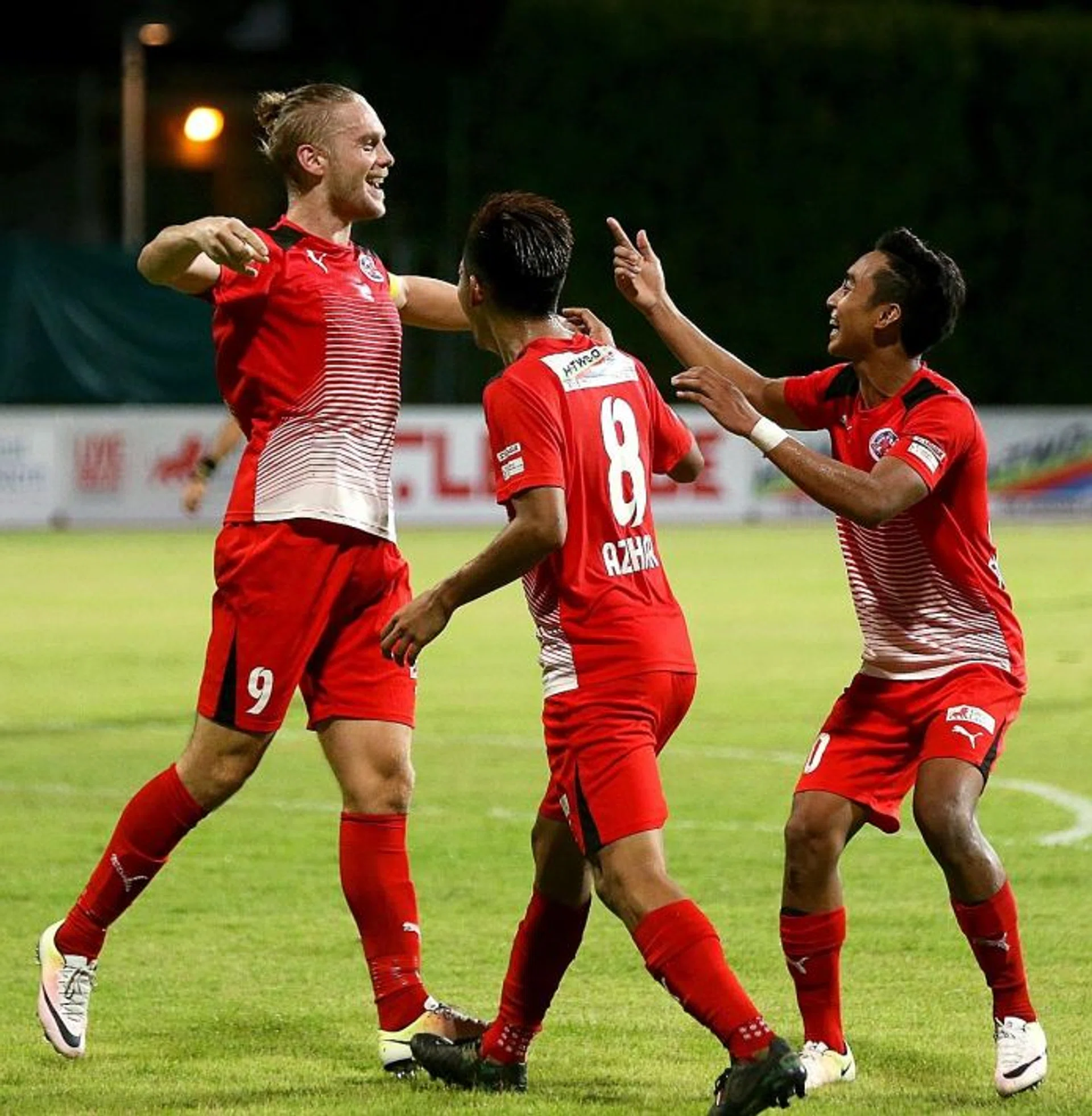 DEADLY TRIO: Home United's recent good form is attributed to Azhar Sairudin (No. 8) providing the assists and forwards Ken Ilso (far left) and Faris Ramli (above) providing the finishing touches.