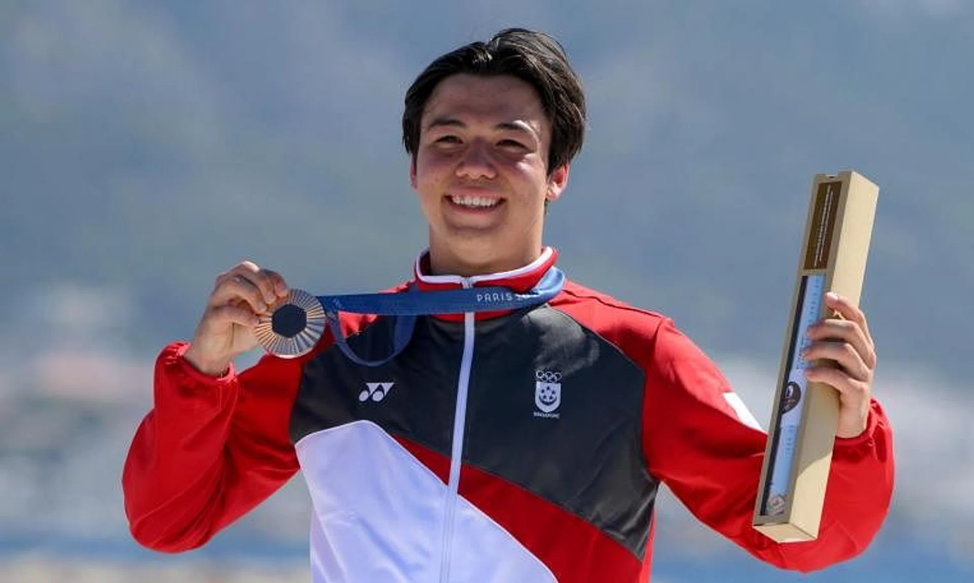 Singaporean kitefoiler Maximilian Maeder with his Paris 2024 bronze medal. It is the country's first medal since Joseph Schooling won gold at Rio 2016.