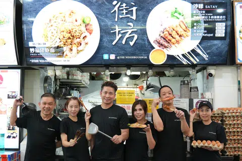 The Neighbourwok's Kelvin Teo and Joreen Ong (third and fourth from left) with their staff (from left) Yap Kok Wai, Pham Thi Bich Tram, Lee Kim Foong and Pham Thi Kim Phung.