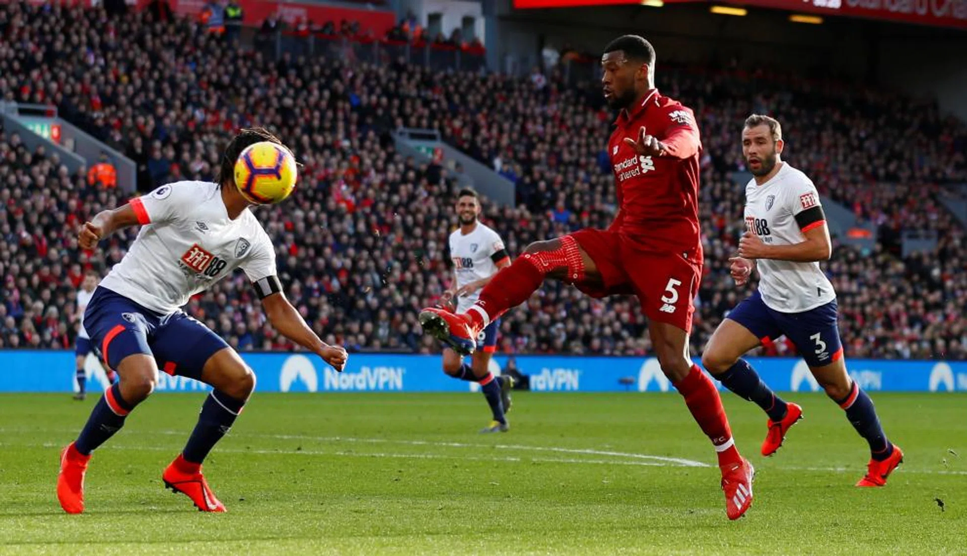 Liverpool's Georginio Wijnaldum  (in red) scoring the second goal in their 3-0 win over Bournemouth with a sublime lob. 