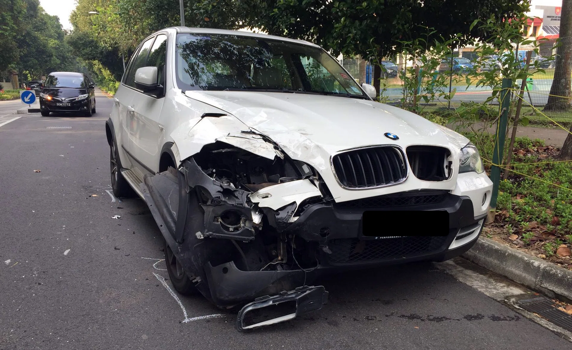 BMW smashes into back of police car | The New Paper